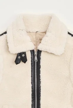 Blouson sans manches en moumoute