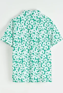 Chemise à manches courtes avec col et imprimé floral blanc sur fond camel
