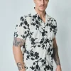 Chemise manches courtes à motifs fleuris