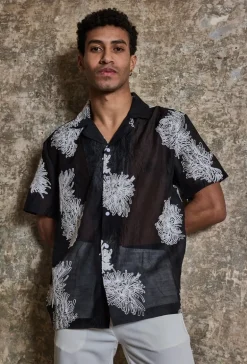 Chemise manches courtes à motifs fleuris broder