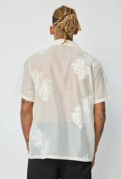 Chemise manches courtes à motifs fleuris broder