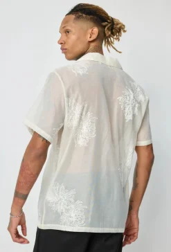 Chemise manches courtes à motifs fleuris broder