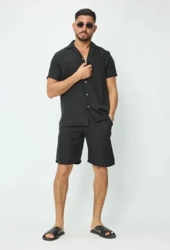 Chemise manches courtes à bouton