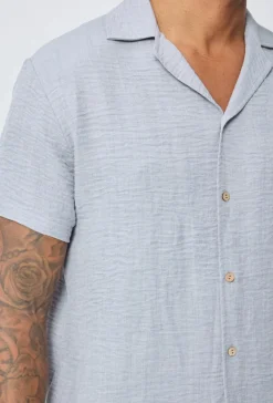 Chemise manches courtes à bouton