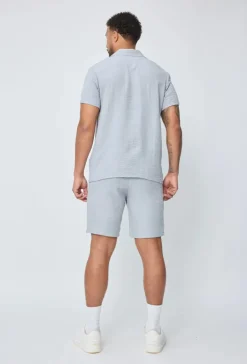 Chemise manches courtes à bouton