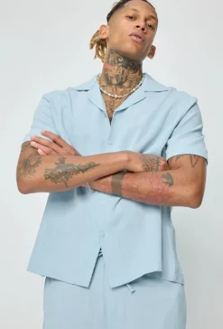 Chemise unie à boutons manches courtes