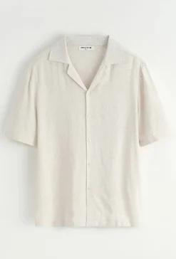 Chemise unie à boutons manches courtes