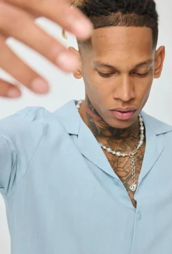 Chemise unie à boutons manches courtes