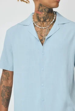 Chemise unie à boutons manches courtes