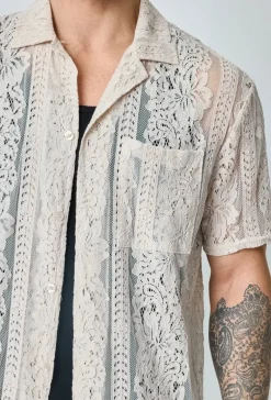 Chemise unie en dentelle manches courtes col à revers