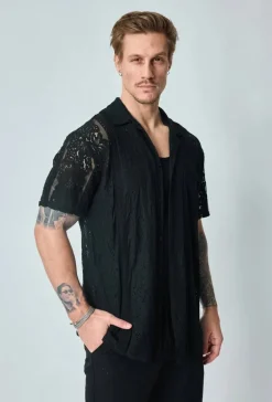 Chemise unie en dentelle manches courtes col à revers