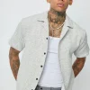 Chemise unie manches courtes