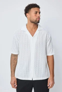 Chemise unie manches courtes à boutons