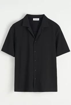 Chemise unie manches courtes