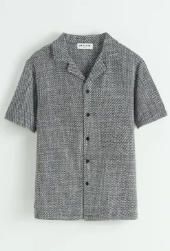 Chemise unie manches courtes