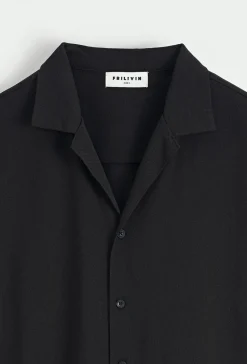 Chemise unie manches courtes