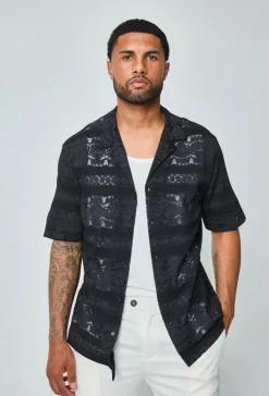 Chemise unie manches courtes à motifs