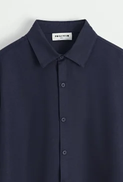 Chemise unie manches longues