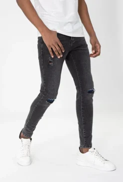 Jean effet déchiré avec empiècement