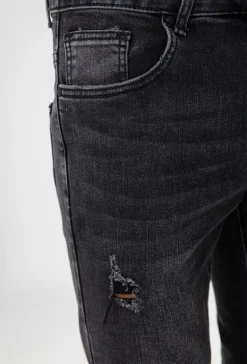 Jean effet déchiré avec empiècement