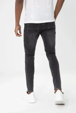Jean effet déchiré avec empiècement