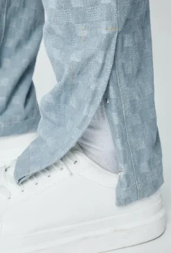 Jean large à motifs damier avec fentes