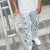 Pantalon droit uni avec patch géométrique