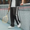 Pantalon jogging large à bandes
