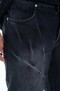 Pantalon noir délavé à détails