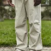 Pantalon parachute ajustable à la taille et aux cheville