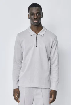 Polo couleur uni manche longue à zip