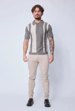 Polo zippé à rayures latérales