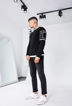 Pull à manches longues avec design carré et zip sur la manche