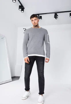 Pull à manches longues avec design carré et zip sur la manche