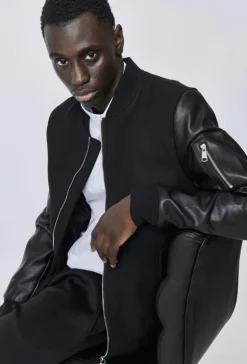 Veste avec manche simili cuire