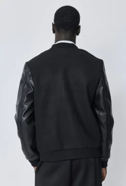 Veste avec manche simili cuire