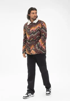 Veste avec un mélange de motifs géométriques colorés