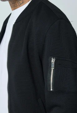 Veste teddy uni motifs géométriques
