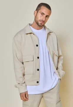 Veste uni texturé avec grandes poches à rabat