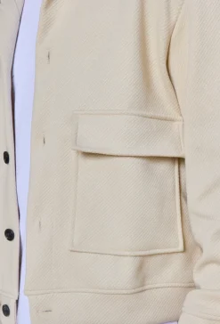 Veste uni texturé avec grandes poches à rabat